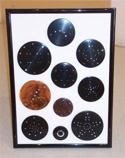 Sample display of inlaid lids by Pat Hughes